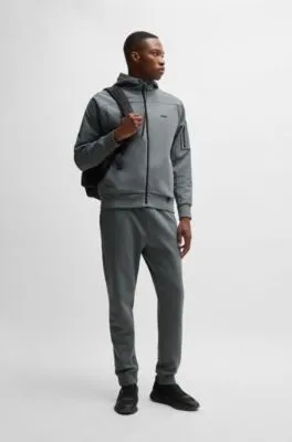 Tracksuit bottoms with decorative reflective logo